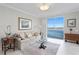 Sitting room with water views and comfortable seating at 4993 Bacopa S Ln # 705, St Petersburg, FL 33715
