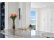 Kitchen features granite countertop, white cabinets, and water views at 4993 Bacopa S Ln # 705, St Petersburg, FL 33715