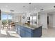 Modern kitchen with island, stainless steel appliances, and water views at 4993 Bacopa S Ln # 705, St Petersburg, FL 33715