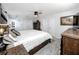 Main bedroom with wood furniture and large bed at 11624 Pinedale Ave, Seminole, FL 33772