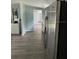 Kitchen with stainless steel appliances and wood-look floors at 11911 Rhodine Rd, Riverview, FL 33579