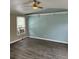 Living room with light walls, vinyl flooring and ceiling fan at 11911 Rhodine Rd, Riverview, FL 33579