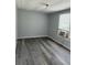 Spacious bedroom with vinyl flooring and window at 11911 Rhodine Rd, Riverview, FL 33579