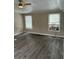 Large living area with vinyl flooring and window coverings at 11911 Rhodine Rd, Riverview, FL 33579