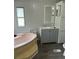 Updated bathroom with new vanity and flooring at 11911 Rhodine Rd, Riverview, FL 33579