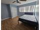 Bright bedroom with double bed, wood floors, and spacious closet at 12125 93Rd Way, Largo, FL 33773