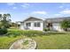 View of the backyard and patio area at 1321 Bluewater Dr, Sun City Center, FL 33573