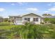View of the backyard and screened in porch at 1321 Bluewater Dr, Sun City Center, FL 33573