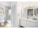 Bathroom featuring shower-tub combo and a white vanity at 1321 Bluewater Dr, Sun City Center, FL 33573