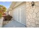 Exterior view of home featuring stonework and a secured entry at 1321 Bluewater Dr, Sun City Center, FL 33573