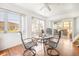 Bright sunroom with lots of windows and a ceiling fan at 1321 Bluewater Dr, Sun City Center, FL 33573