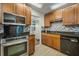 Modern kitchen with stainless steel appliances, granite countertops, and stylish backsplash at 1321 Bluewater Dr, Sun City Center, FL 33573