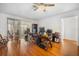 Bright living space featuring natural lighting, wood floors, and a view of the lanai at 1321 Bluewater Dr, Sun City Center, FL 33573
