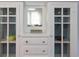 White built-in cabinet with glass doors and drawers at 155 12Th Ne Ave, St Petersburg, FL 33701