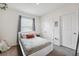 Bedroom with full-size bed, window and closet at 16701 Maude Dr, Wimauma, FL 33598