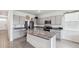 Modern kitchen with granite countertops and stainless steel appliances at 16701 Maude Dr, Wimauma, FL 33598