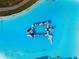 Aerial view of an inflatable aqua park in a lagoon pool at 16701 Maude Dr, Wimauma, FL 33598