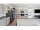 Modern kitchen with granite countertops and stainless steel appliances at 16701 Maude Dr, Wimauma, FL 33598