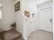 Bright and airy entryway with staircase and tile flooring at 16701 Maude Dr, Wimauma, FL 33598