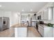 Modern kitchen with granite countertops and stainless steel appliances at 16701 Maude Dr, Wimauma, FL 33598
