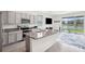 Modern kitchen with granite countertops and stainless steel appliances at 16701 Maude Dr, Wimauma, FL 33598