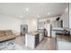 Modern kitchen with granite countertops and stainless steel appliances at 16701 Maude Dr, Wimauma, FL 33598