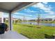 Backyard patio overlooking a lake at 16701 Maude Dr, Wimauma, FL 33598