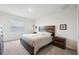 Spacious bedroom with king-size bed and wood furniture at 16701 Maude Dr, Wimauma, FL 33598