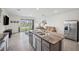 Modern kitchen with granite countertops and stainless steel appliances at 16701 Maude Dr, Wimauma, FL 33598