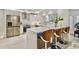 Modern kitchen with stainless steel appliances and white cabinets at 2101 Sunset Point Rd # 1501, Clearwater, FL 33765