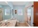 Clean bathroom featuring a shower/tub, vanity, and window at 2296 Lake Forest Ave, Spring Hill, FL 34609