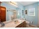 Bright bathroom with single sink vanity, shower/tub combo, and tile flooring at 2296 Lake Forest Ave, Spring Hill, FL 34609