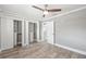 Bright bedroom with wood-look floors and built-in closet at 7343 Brookview Cir, Tampa, FL 33634