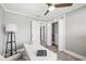 Home office with built-in closet and wood-look floors at 7343 Brookview Cir, Tampa, FL 33634