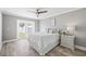 Bedroom with backyard access and ceiling fan at 7343 Brookview Cir, Tampa, FL 33634