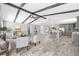 Open floor plan living area with kitchen and vaulted ceilings at 7343 Brookview Cir, Tampa, FL 33634