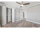 Bedroom with wood-look floors and built-in closet at 7343 Brookview Cir, Tampa, FL 33634