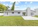 Updated house exterior, showcasing a modern design at 7343 Brookview Cir, Tampa, FL 33634