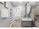Updated bathroom with granite countertop and stone tile shower at 7343 Brookview Cir, Tampa, FL 33634