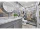 Modern bathroom with stone tile and updated vanity at 7343 Brookview Cir, Tampa, FL 33634
