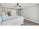 Main bedroom with private ensuite bathroom and a ceiling fan at 7343 Brookview Cir, Tampa, FL 33634