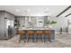 Modern kitchen boasts gray cabinets, granite countertops, and stylish backsplash at 7343 Brookview Cir, Tampa, FL 33634