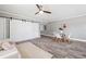 Living room features sliding barn doors and a neutral color palette at 7343 Brookview Cir, Tampa, FL 33634