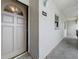 Condo hallway with gray door and tiled flooring at 7701 Starkey Rd # 324, Seminole, FL 33777