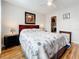 Main bedroom with a queen bed, nightstands, and wood floors at 7701 Starkey Rd # 324, Seminole, FL 33777