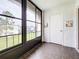 Sunroom with view of the community and tiled floors at 7701 Starkey Rd # 324, Seminole, FL 33777