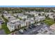 Aerial view of an apartment complex with a pool and ample parking at 7701 Starkey Rd # 324, Seminole, FL 33777