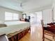 Bedroom with a queen bed, access to a patio, and a small desk at 7701 Starkey Rd # 324, Seminole, FL 33777