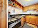 Modern kitchen with stainless steel appliances and open pass-through to living area at 7701 Starkey Rd # 324, Seminole, FL 33777