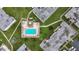 An inviting community pool surrounded by lounge chairs and lush greenery at 7701 Starkey Rd # 324, Seminole, FL 33777